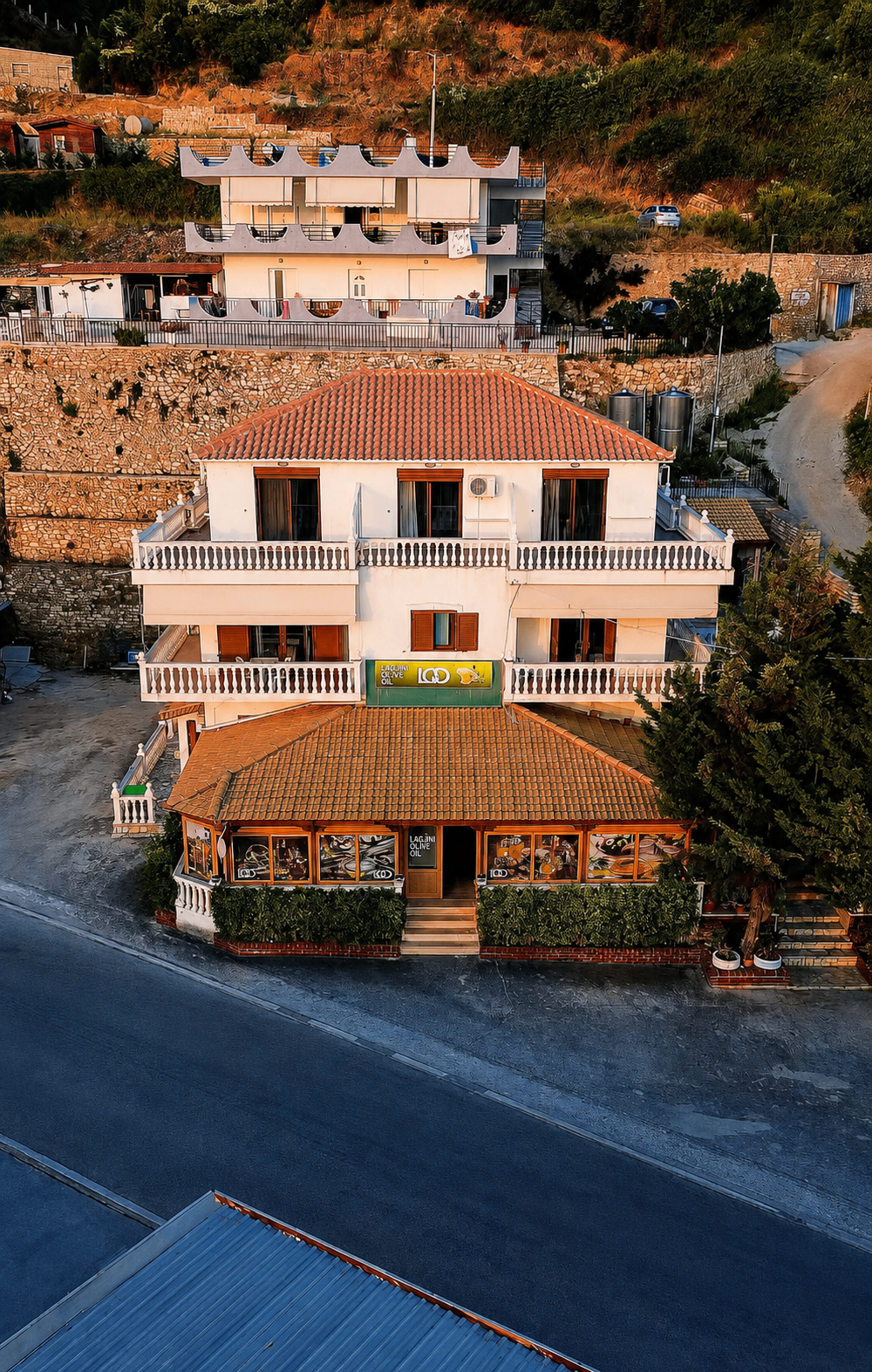 Kompleks Angjelo aparthotel in Lukovë at golden hour